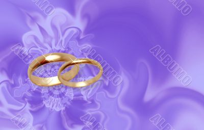 Wedding rings on lilac