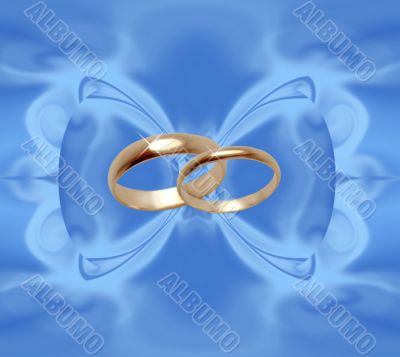 Wedding rings on blue bow