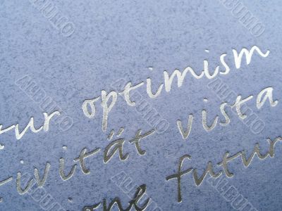 Blue paper background with silver lettered