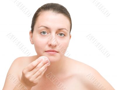 girl cleansing her face