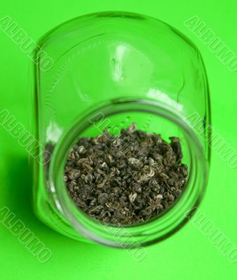 Green tea in glass jar