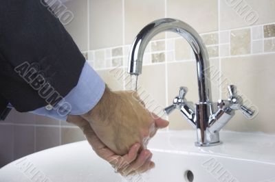 businessmen washing hands