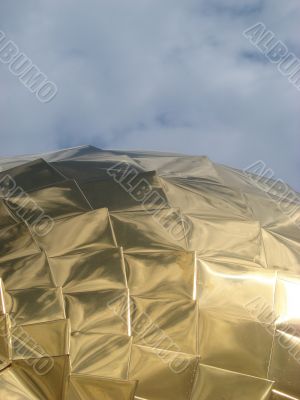 Golden church cupola mirroring surface