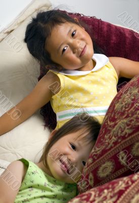 Sisters on bed