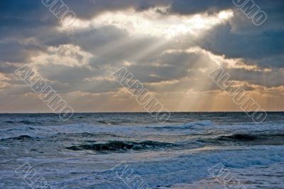 sun rays on an angry sea