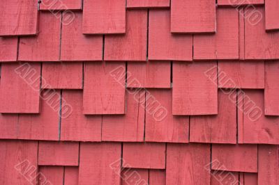 weathered red shake siding background