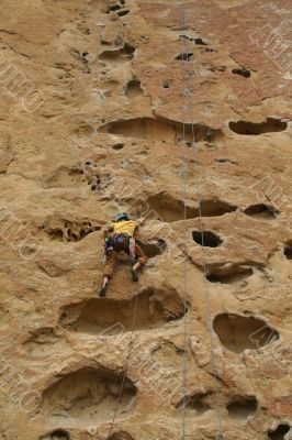 Rock climber on potholes route