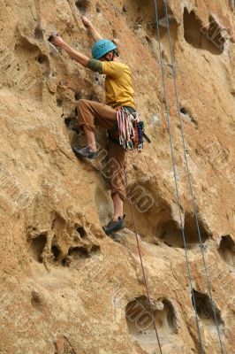 Rock climber on potholes route Rock climber on potholes route