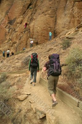 Climbers approaching rock face