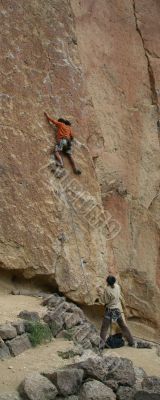 Climber on unprotected face route