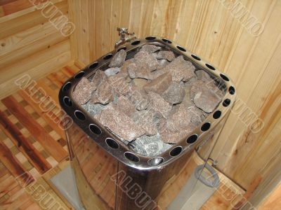 classic wooden dry sauna inside hot stones
