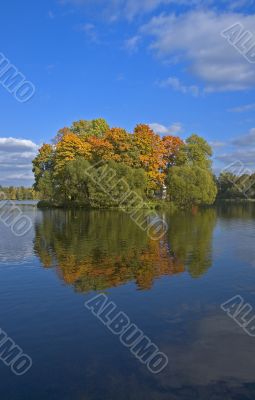autumn island reflecting in water