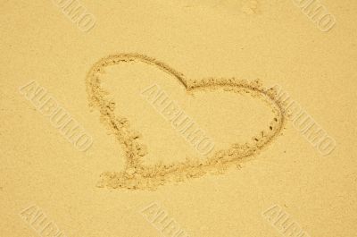 heart drawn in the sand
