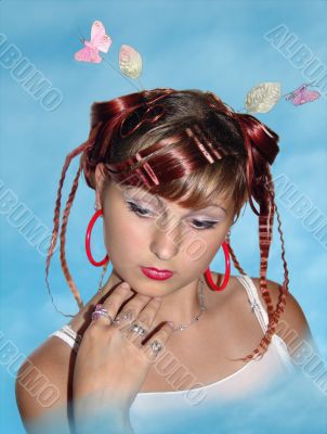 Girl with beautiful coiffure in a blue fog