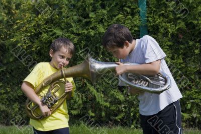 brothers playing on the  horn