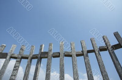 old fence against blue sky