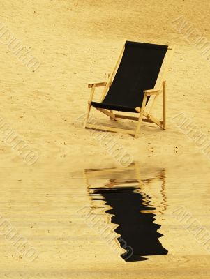 beach chair reflecting in water