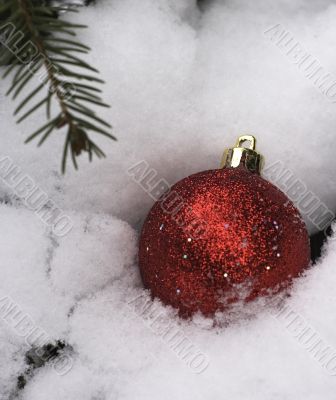 christmas bauble in white snow
