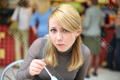 Eating girl with spoon in fast food restaurant #1