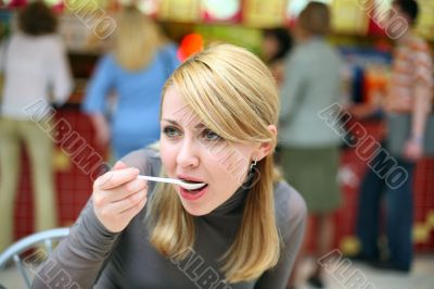 Eating girl with spoon in fast food restaurant #2