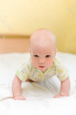 Baby crawl on bed
