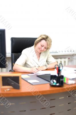 Mid-life business woman write document #1