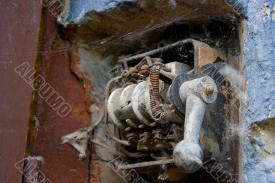 Grunge rusty mechanical electric switch in spider`s web #1 Grunge rusty mechanical electric switch in spider`s web #1