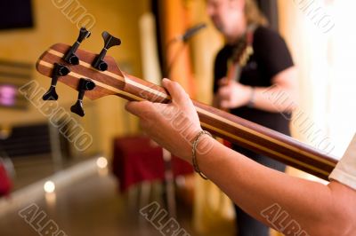 Musician play on bass guitar #2 Musician play on bass guitar #2
