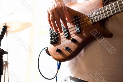 Musician play on bass guitar #3