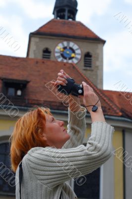 Woman take a picture against the tower background
