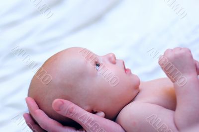 Mother hold baby in hands