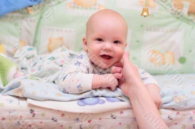 Baby rest on bed and look at camera #3