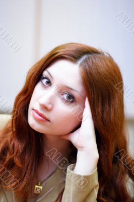 Portrait of girl with reddish hair in office