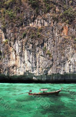 longtail boat in turquoise waters