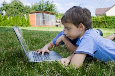 Two cute boy study on computer