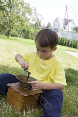 Boy and coffee mill