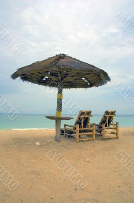 beach chairs and umbrella