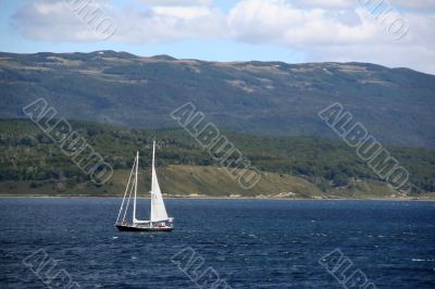 Sailboat in deceptively calm waters