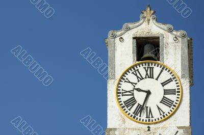 ancient clock over blue sky with space for text