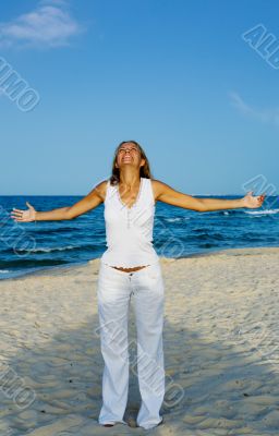Young woman Relaxation exercise on beach