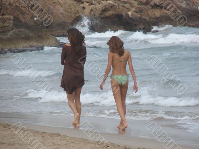 Girls going on a sea beach in the morning