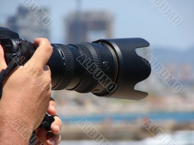 The camera in hands of the photographer