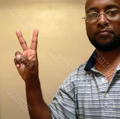 african american man gesturing a peace sign