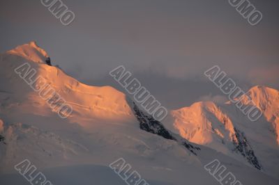 Sunset highlights on steep mountain ridges