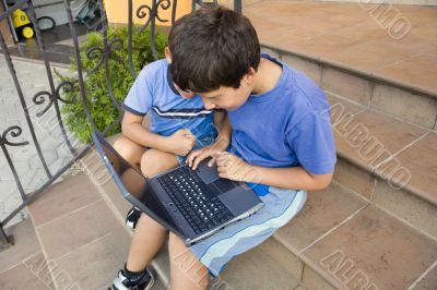 Two cute boy study on computer