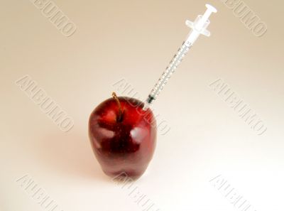 Red apple getting injection