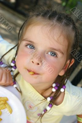 Girl eating french potato