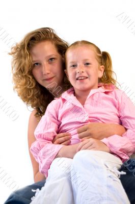 young womand cuddling young child