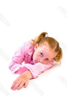 young girl laying on floor