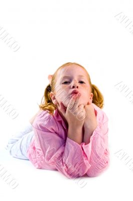 young girl is blowing a kiss
